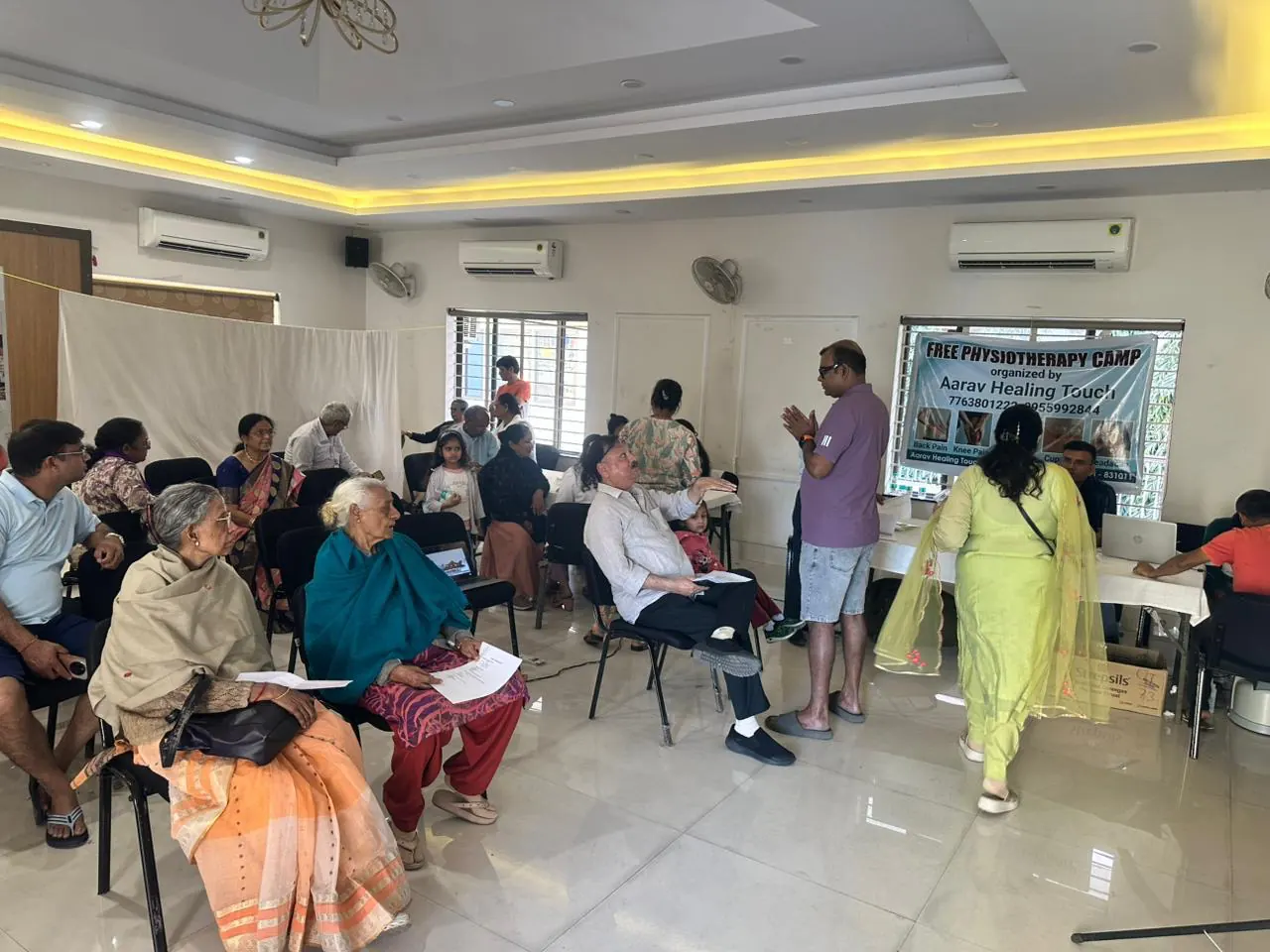 Community members and elderly participants at an Aarav Healing Touch free physiotherapy camp