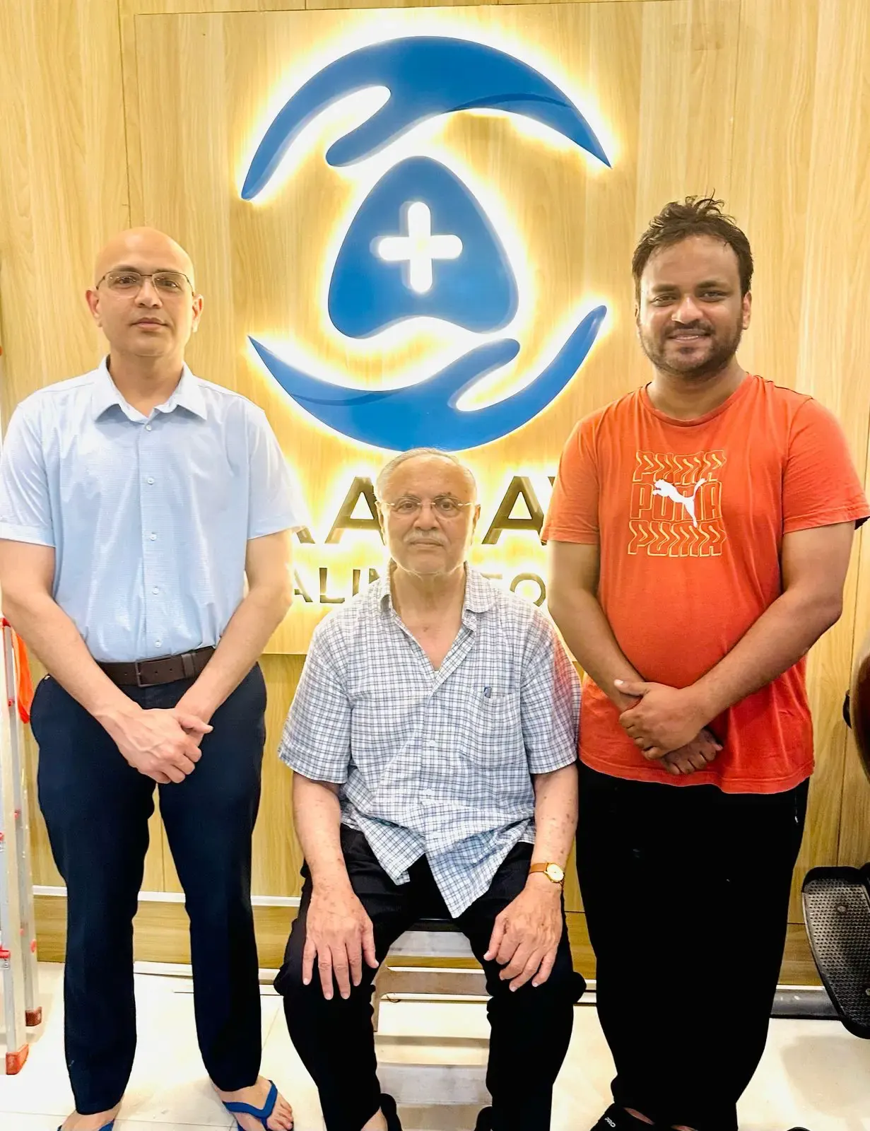 Dr Ravi Bharbaya Daulat and his father at the Aarav Healing Touch clinic